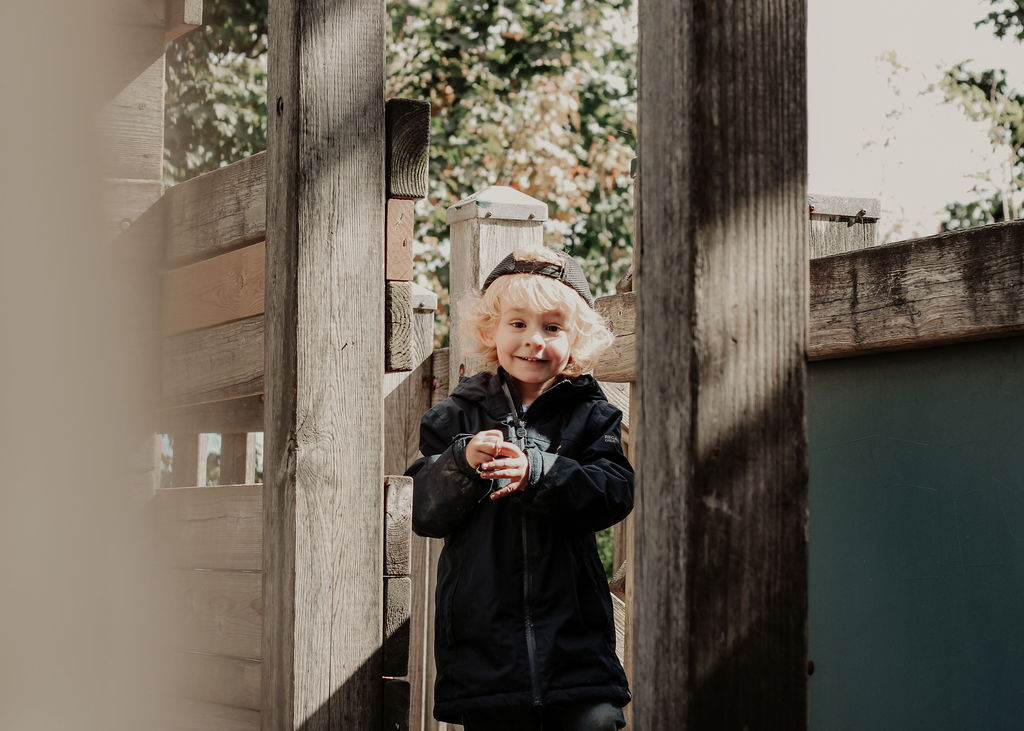 Child smiling outdoors